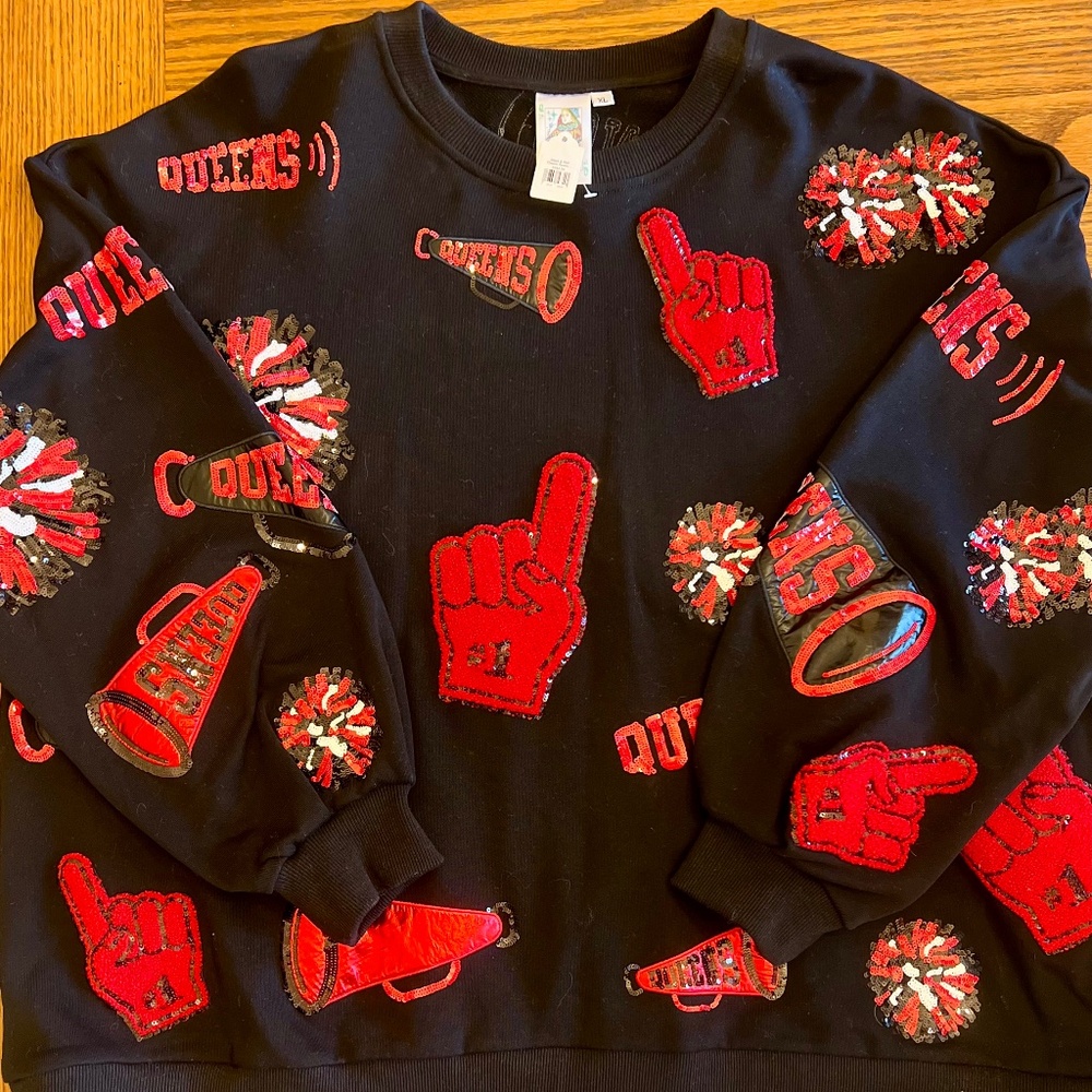 QUEEN OF SPARKLES Black Sweatshirt with Red Pom & Megaphone Appliqués